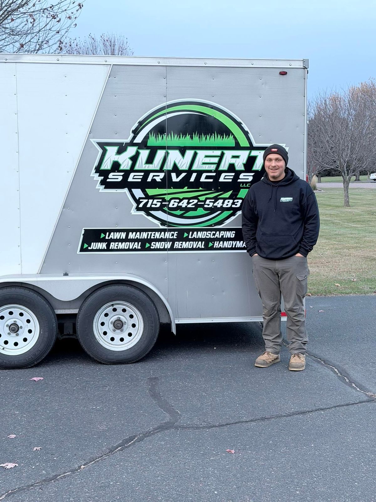 Colten Kunert standing next to trailer