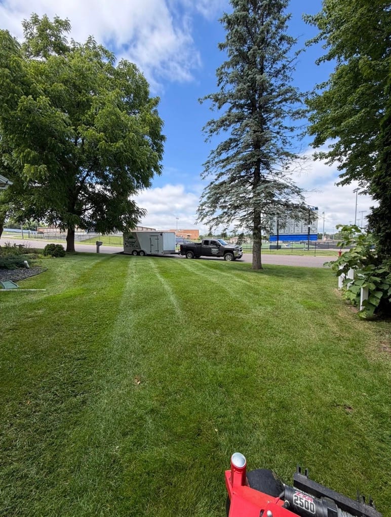 Neat green lawn with truck in background